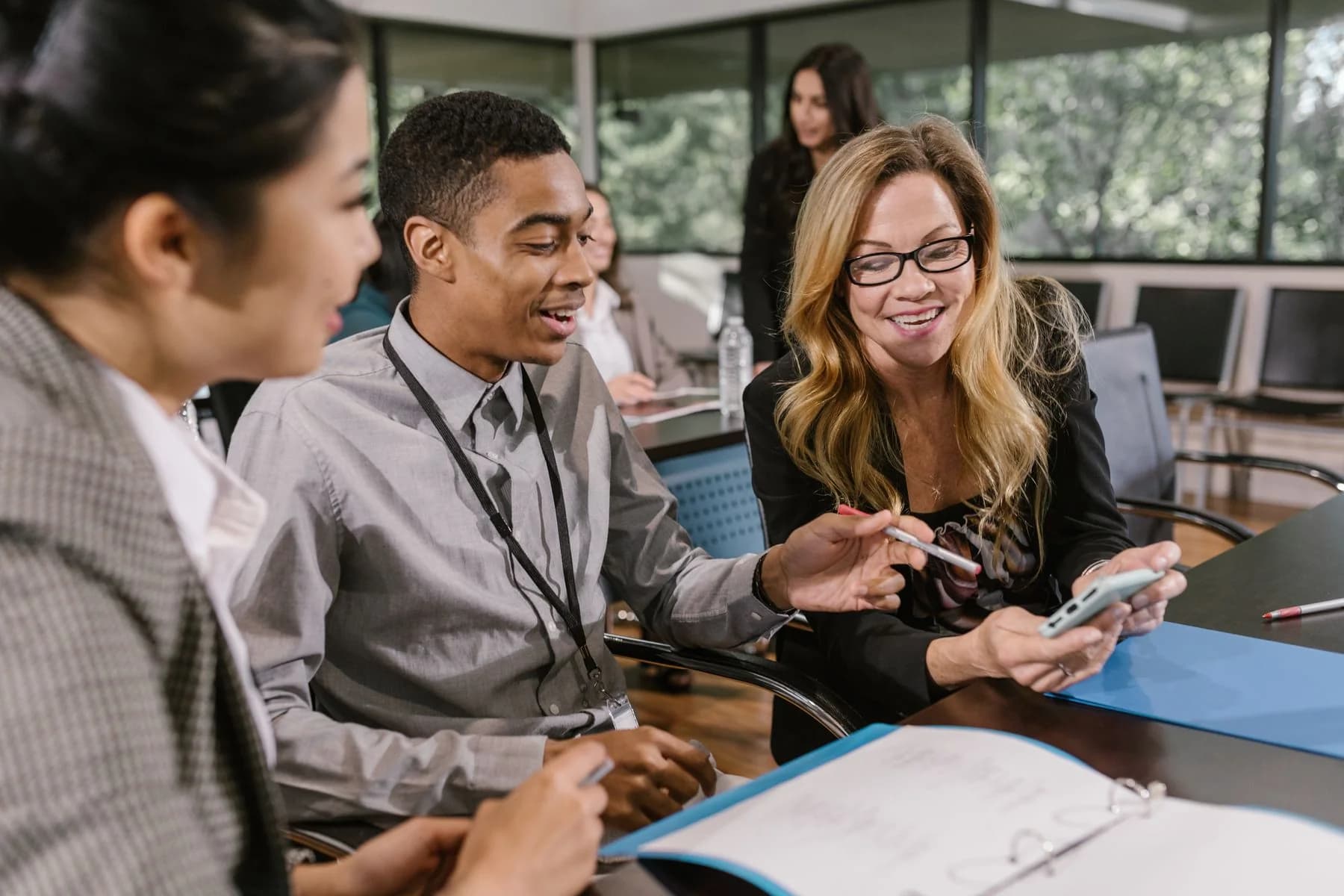 A diverse group of professionals collaborating in an office