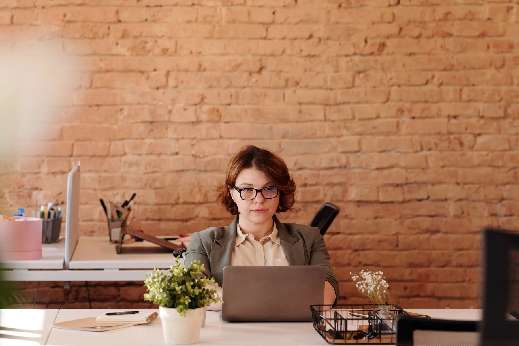 A consultant at work in an open-plan office